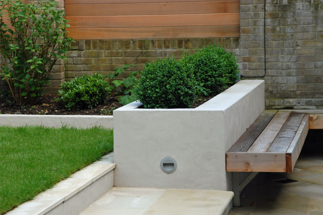 Raised bed and L shaped cantilevered bench